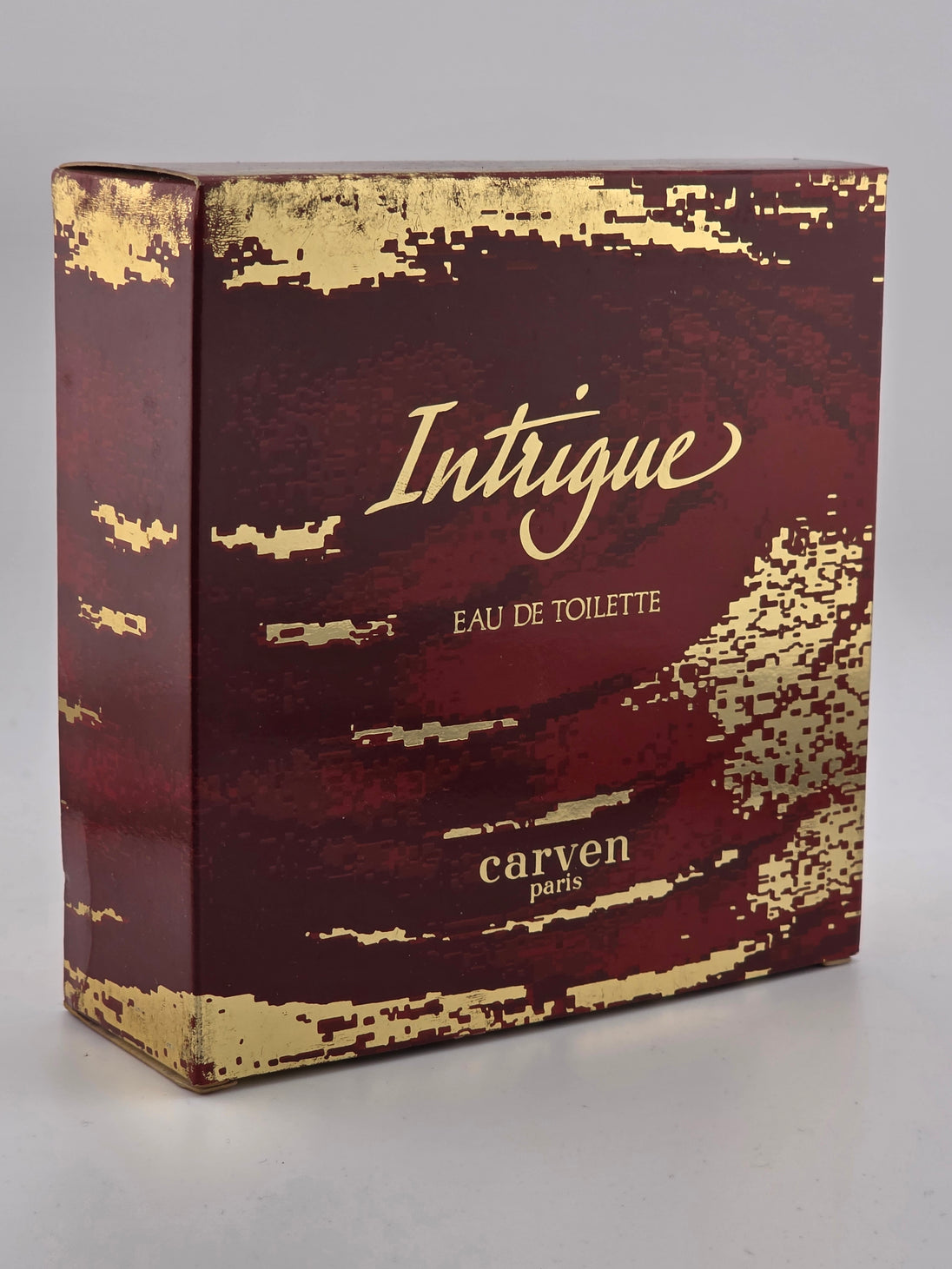 Vintage Carven Intrigue Eau de Toilette in original weinroter Gold-Verpackung, Rarität.